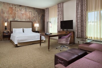 Hypo-allergenic bedding, desk, laptop workspace, blackout curtains