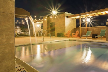 Seasonal outdoor pool, open 7:00 AM to 11:00 PM, sun loungers