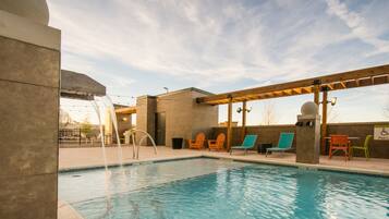 Seasonal outdoor pool, open 7:00 AM to 11:00 PM, pool loungers