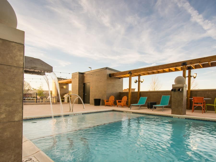 Seasonal outdoor pool, open 7:00 AM to 11:00 PM, sun loungers