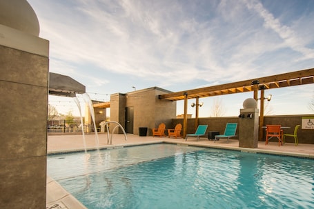 Seasonal outdoor pool, open 7:00 AM to 11:00 PM, pool loungers. Home2 Suites Newnan
