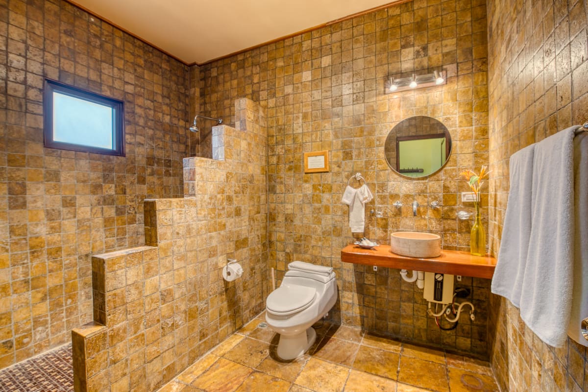 deluxe 2 queen | bathroom | rainfall showerhead, free toiletries, hair dryer, towels