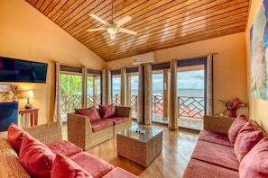 Penthouse Suite | Living area | 32-inch LCD TV with cable channels, TV