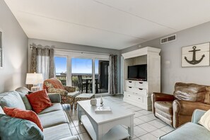 Condo, 2 Bedrooms | Living area | TV, DVD player - Spacious Oceanfront Condo, Easy Access to Private Fishing Pier by RedAwning (Fernandina Beach)