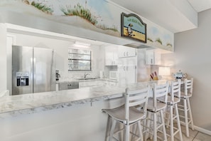 Condo, 2 Bedrooms | Private kitchen | Full-sized fridge, microwave, oven, stovetop - Spacious Oceanfront Condo, Easy Access to Private Fishing Pier by RedAwning (Fernandina Beach)