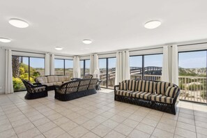 Condo, 2 Bedrooms | Living area | TV, DVD player - Spacious Oceanfront Condo, Easy Access to Private Fishing Pier by RedAwning (Fernandina Beach)