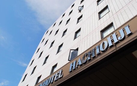 A hotel building with a sign reading "SUNHOTEL".