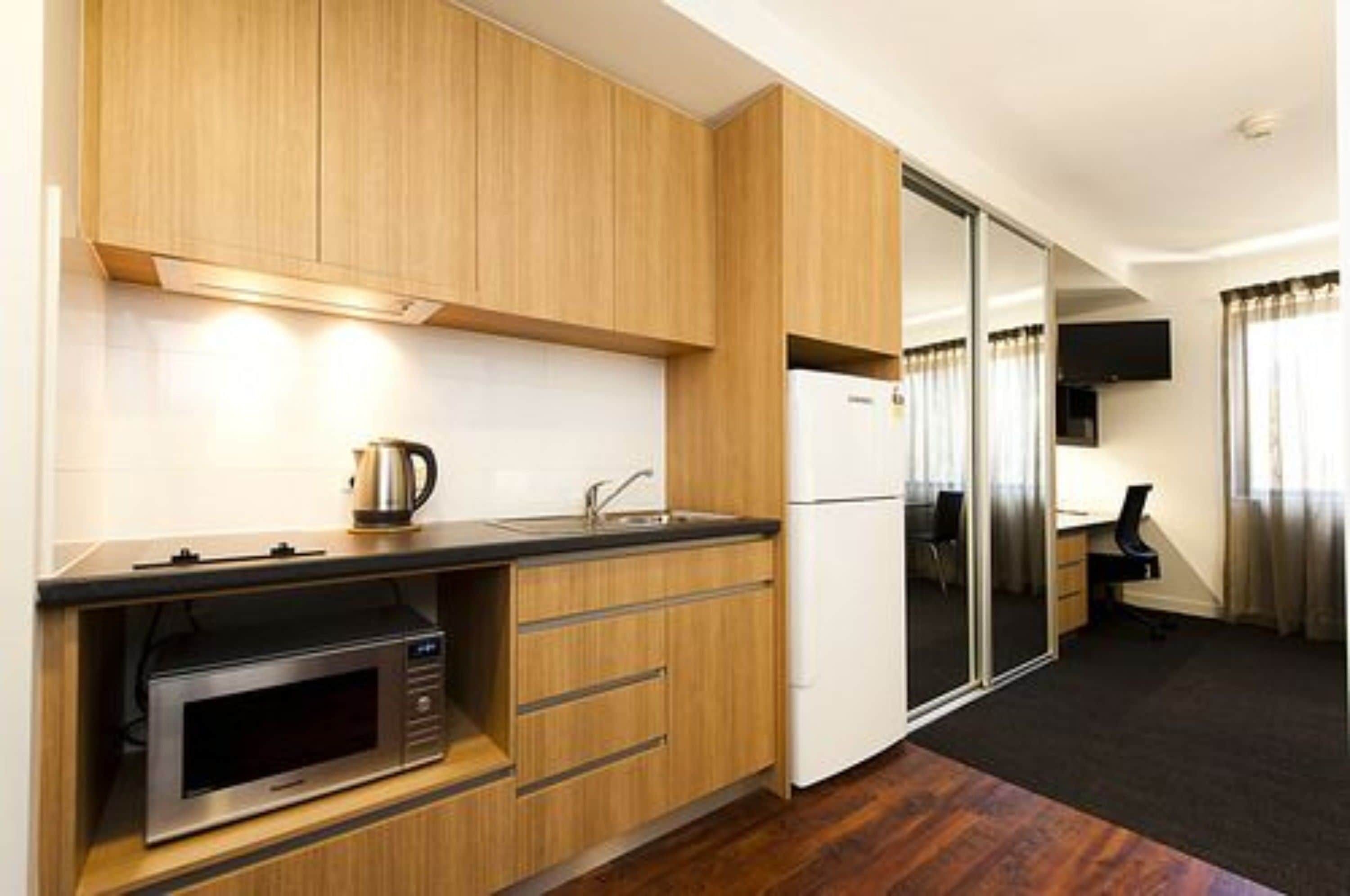 executive studio | private kitchen | full-sized fridge, microwave, oven, coffee/tea maker