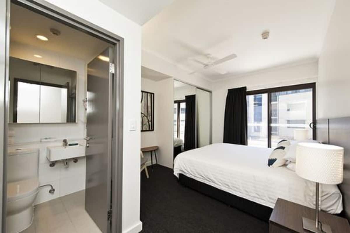 premium one bedroom apartment | desk, laptop workspace, blackout curtains, soundproofing