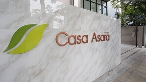 A marble wall with the logo and name 'Casa Asara' prominently displayed. - Casa Asara (Bangkok)