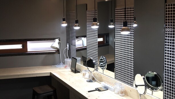 A modern bathroom with a vanity, mirrors, and pendant lighting. - The Bay Guesthouse - Hostel (Busan)