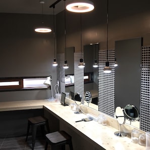 A modern bathroom with a vanity, mirrors, and pendant lighting. - The Bay Guesthouse - Hostel (Busan)
