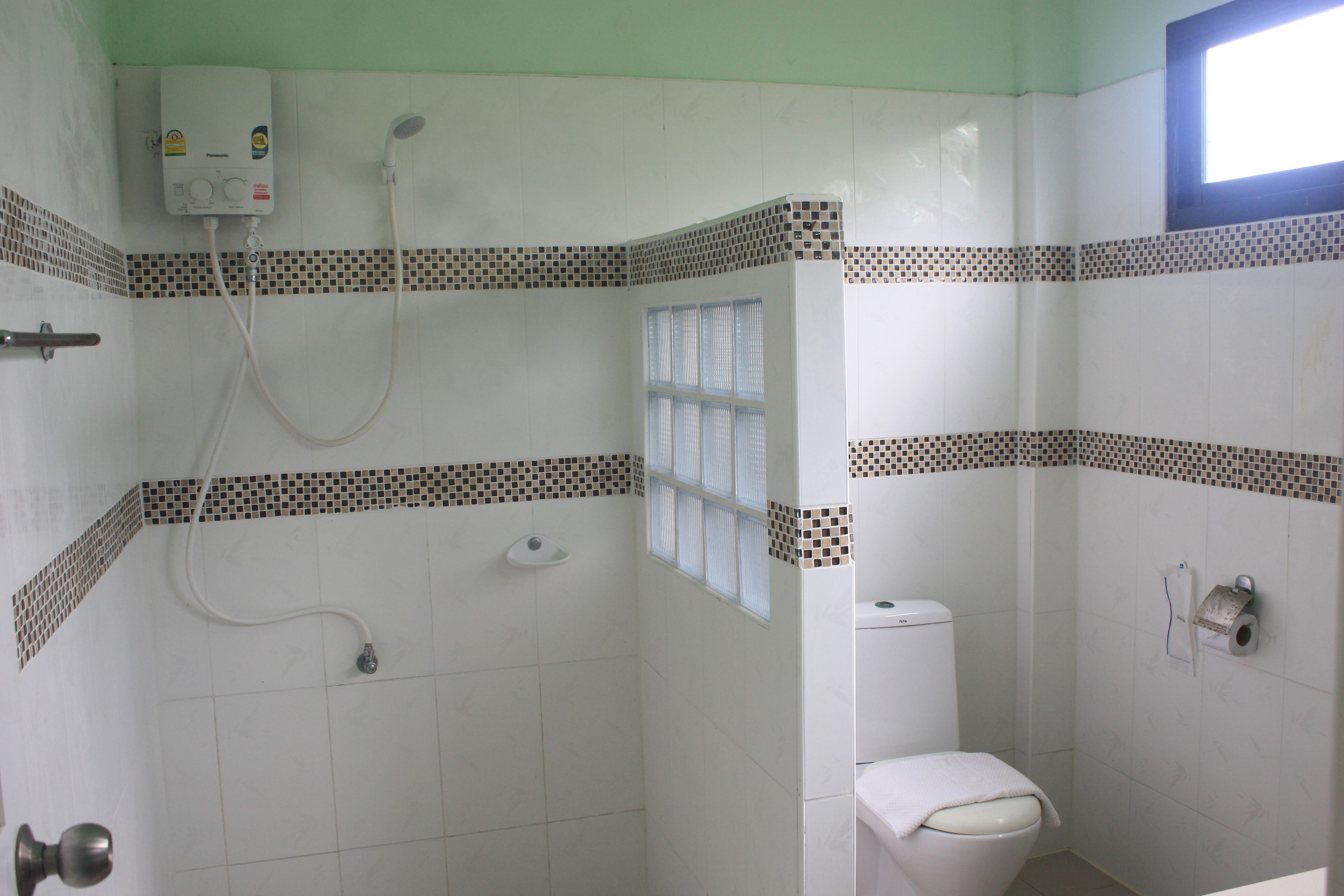 standard double mountain view room | bathroom | shower, free toiletries, hair dryer, towels
