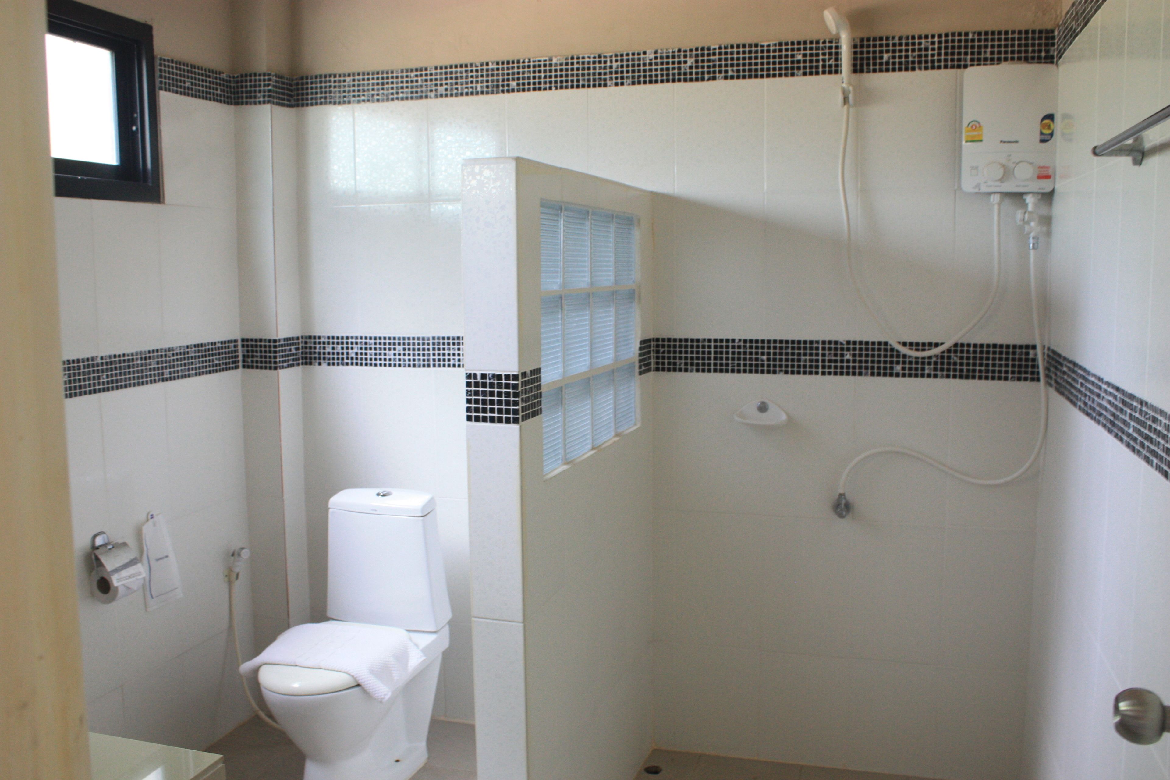 standard twin mountain view room | bathroom | shower, free toiletries, hair dryer, towels