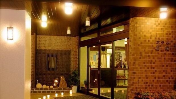 A building entrance with a brick facade, glass doors, and a tiled floor. - Hotel Mimatsu (Nara)