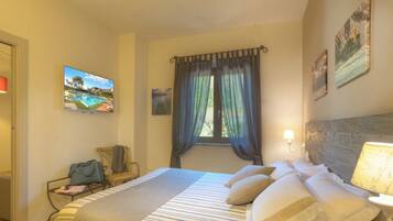 Deluxe Suite | Down duvets, memory-foam beds, in-room safe, desk