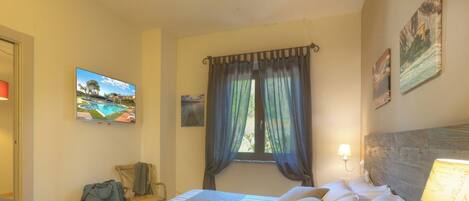 Deluxe Suite | Down duvets, memory-foam beds, in-room safe, desk