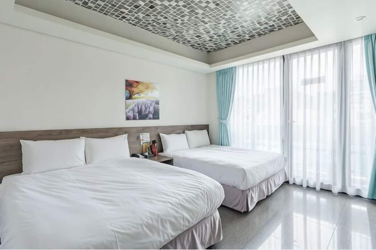 Premium bedding, blackout drapes, soundproofing, free WiFi