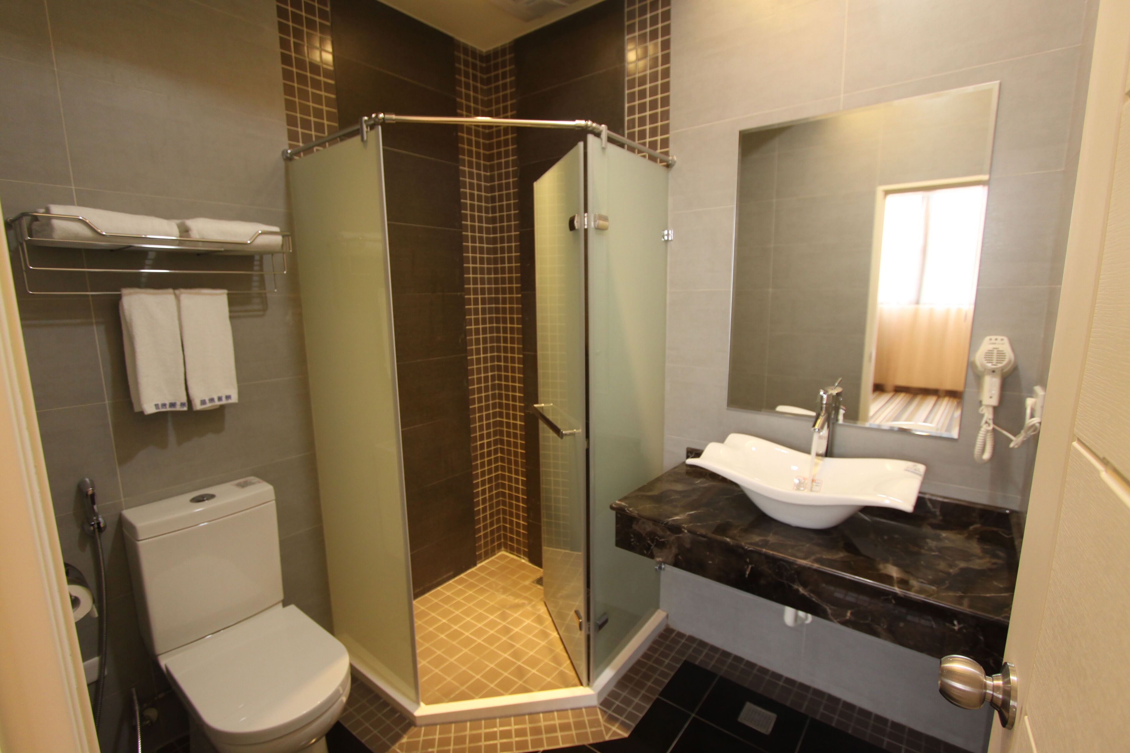 basic triple room (no window)  | bathroom shower