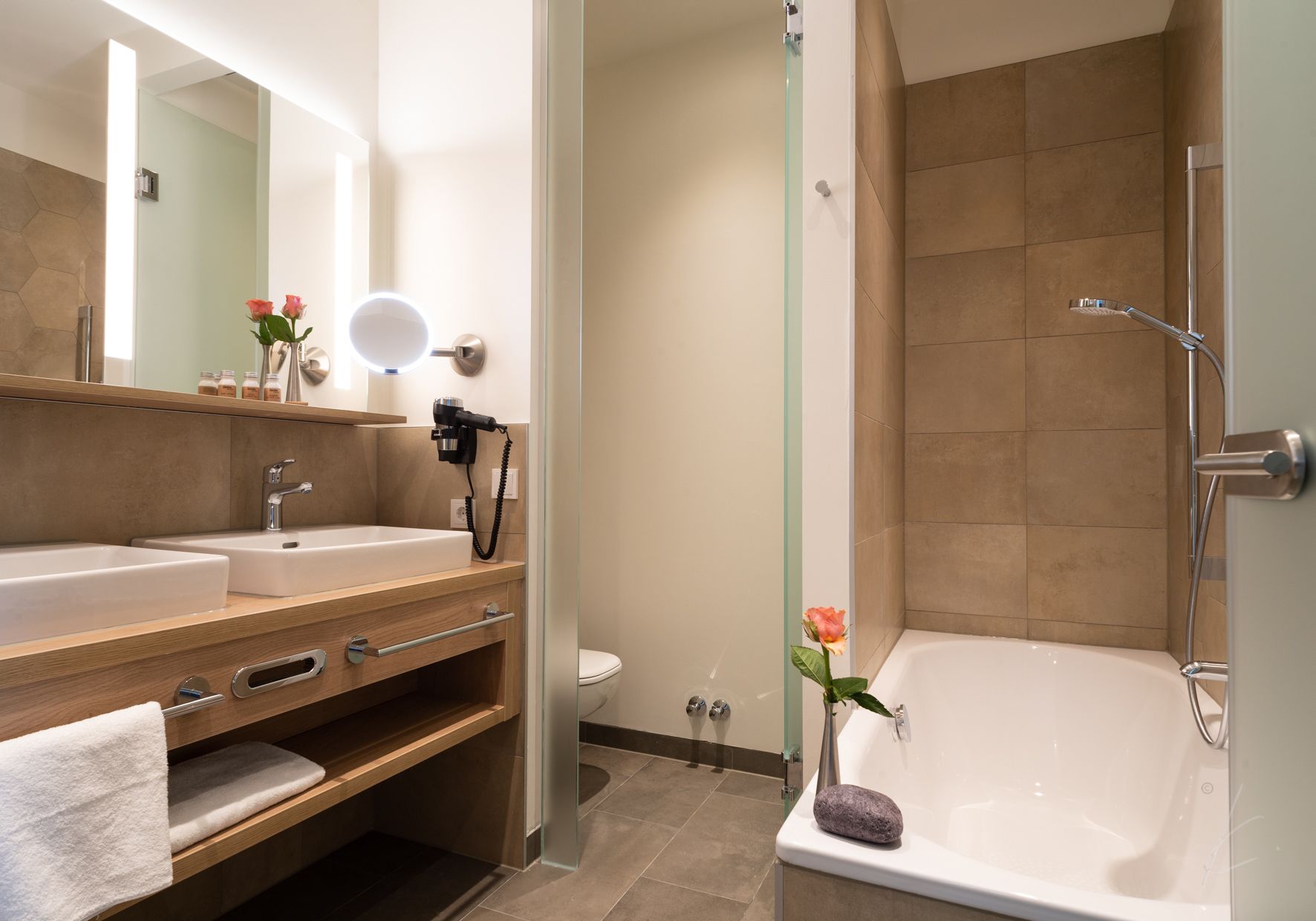 designer toiletries, hair dryer, towels