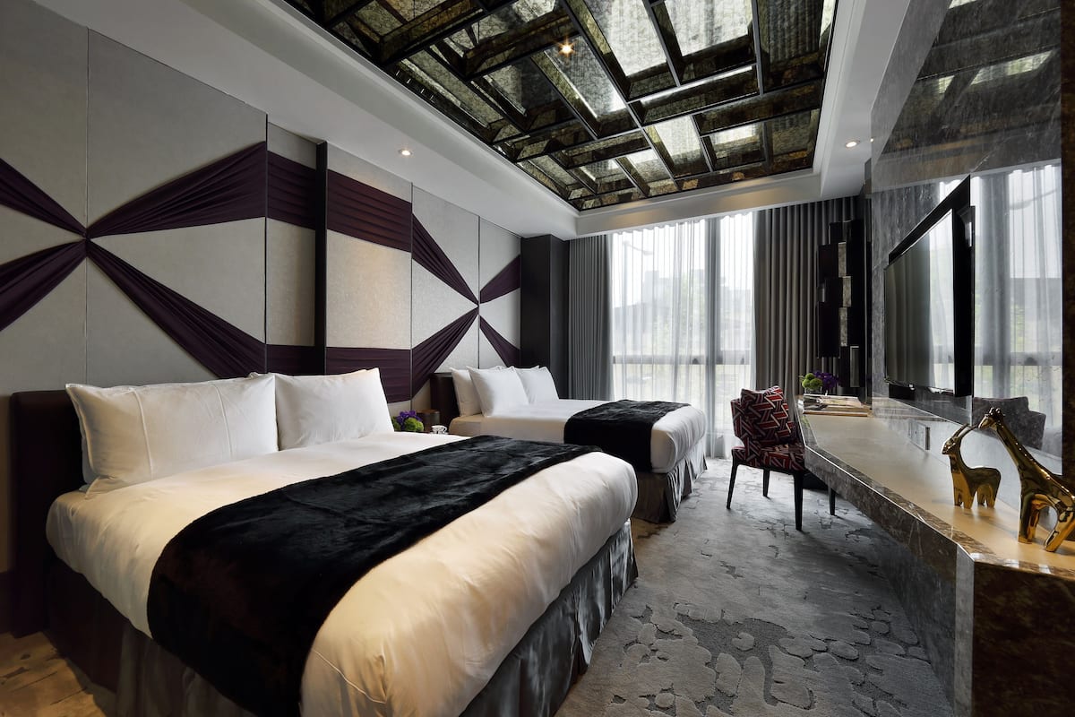 Deluxe Quadruple Room, 2 Double Beds | In-room safe, individually decorated, individually furnished