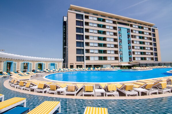 Indoor pool, seasonal outdoor pool, pool umbrellas, pool loungers