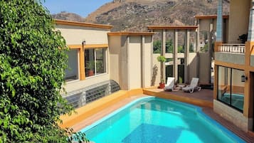 Outdoor pool, open 9:00 AM to 8:00 PM, pool umbrellas, sun loungers