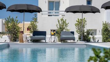 Seasonal outdoor pool, pool umbrellas, pool loungers