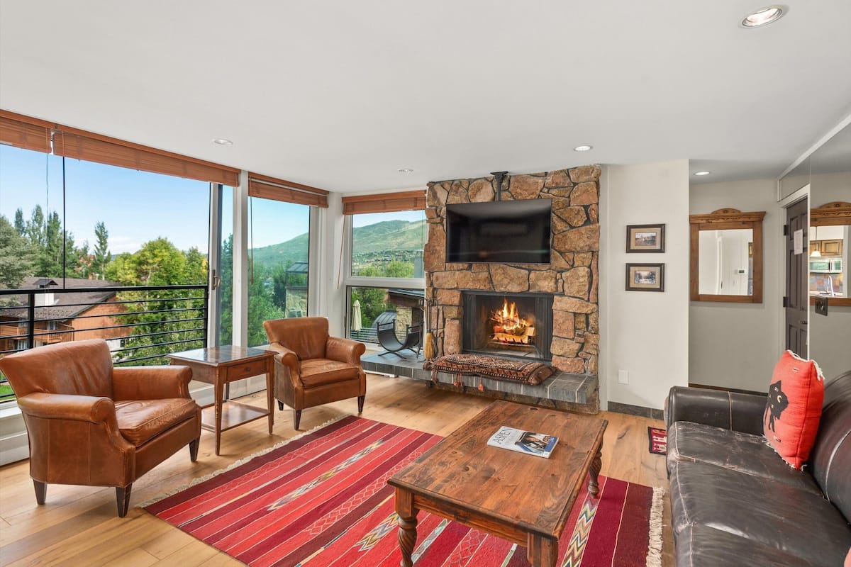 Deluxe Condo, 1 Bedroom, Fireplace, Hill View (A101) | Living area | Flat-screen TV