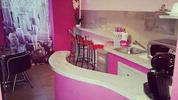 Fridge, microwave, electric kettle, cookware/dishes/utensils
