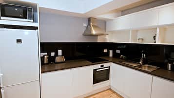 Apartment (4 adults) | Private kitchen | Fridge, microwave, oven, stovetop