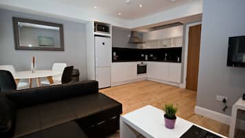 Apartment (4 adults) | Living area | Flat-screen TV