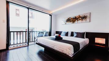 Habitación Deluxe | Ropa de cama de alta calidad, minibar, escritorio y cortinas opacas