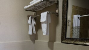 A bathroom with a white toilet, a white sink, and a mirror above the sink.