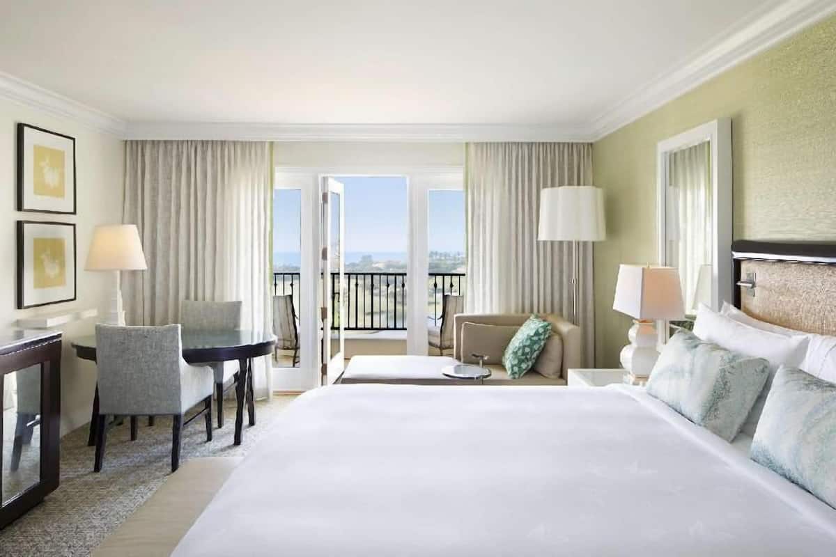 Premium bedding, down comforters, minibar, in-room safe