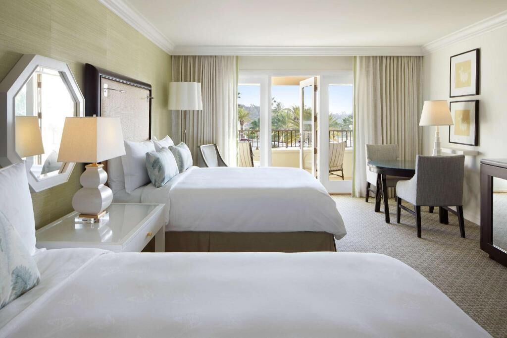 Premium bedding, down comforters, minibar, in-room safe