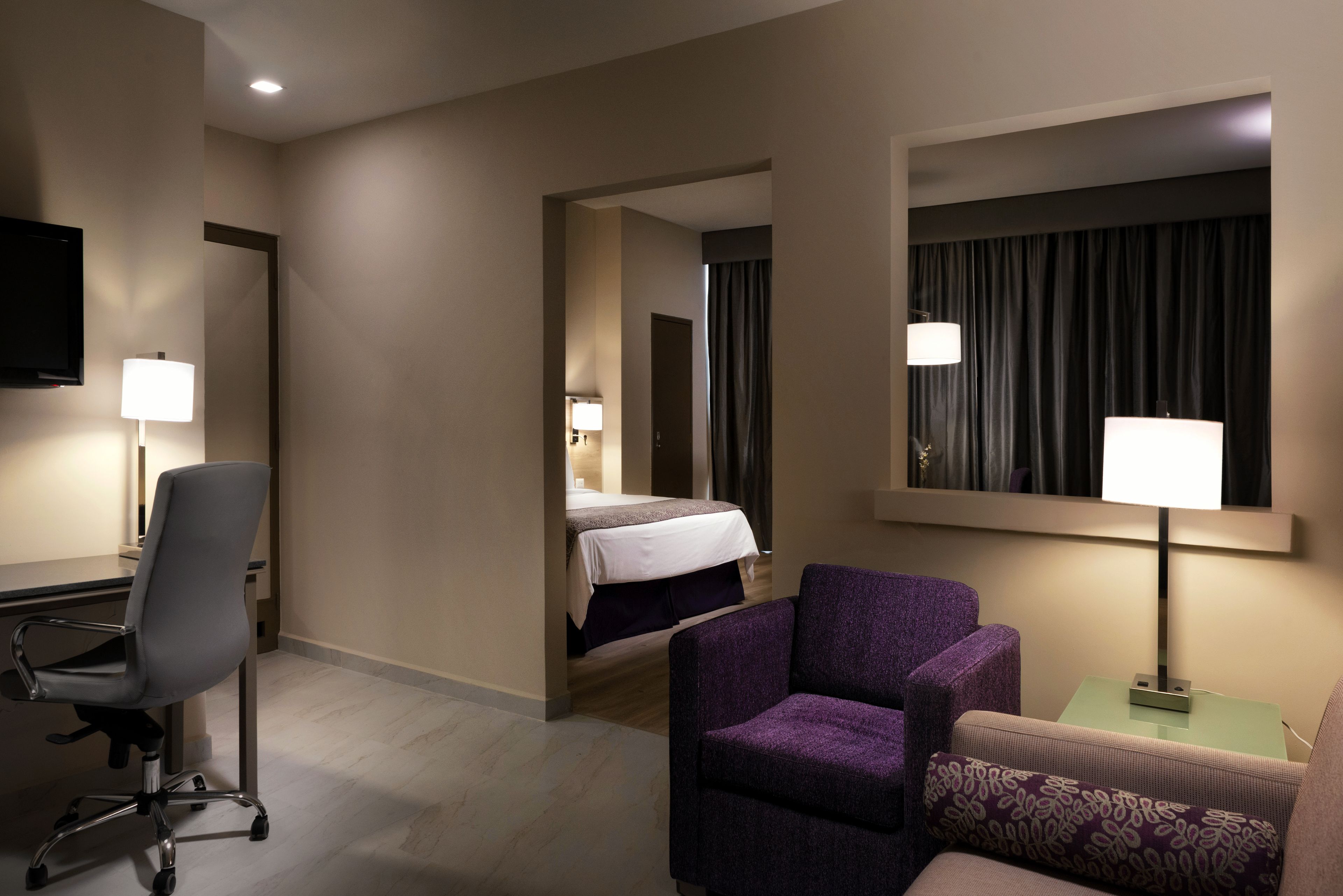 junior suite | 1 bedroom, in-room safe, desk, iron/ironing board