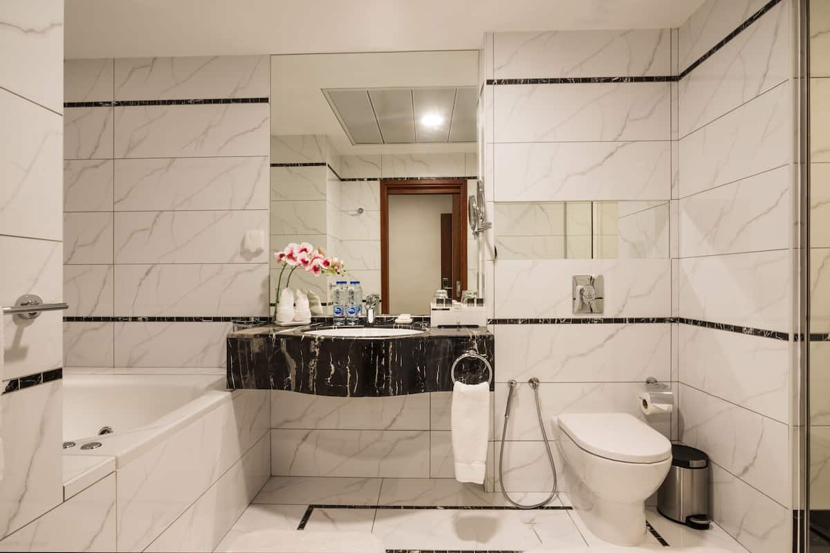 superior room, jetted tub | bathroom | shower, free toiletries, hair dryer, bathrobes