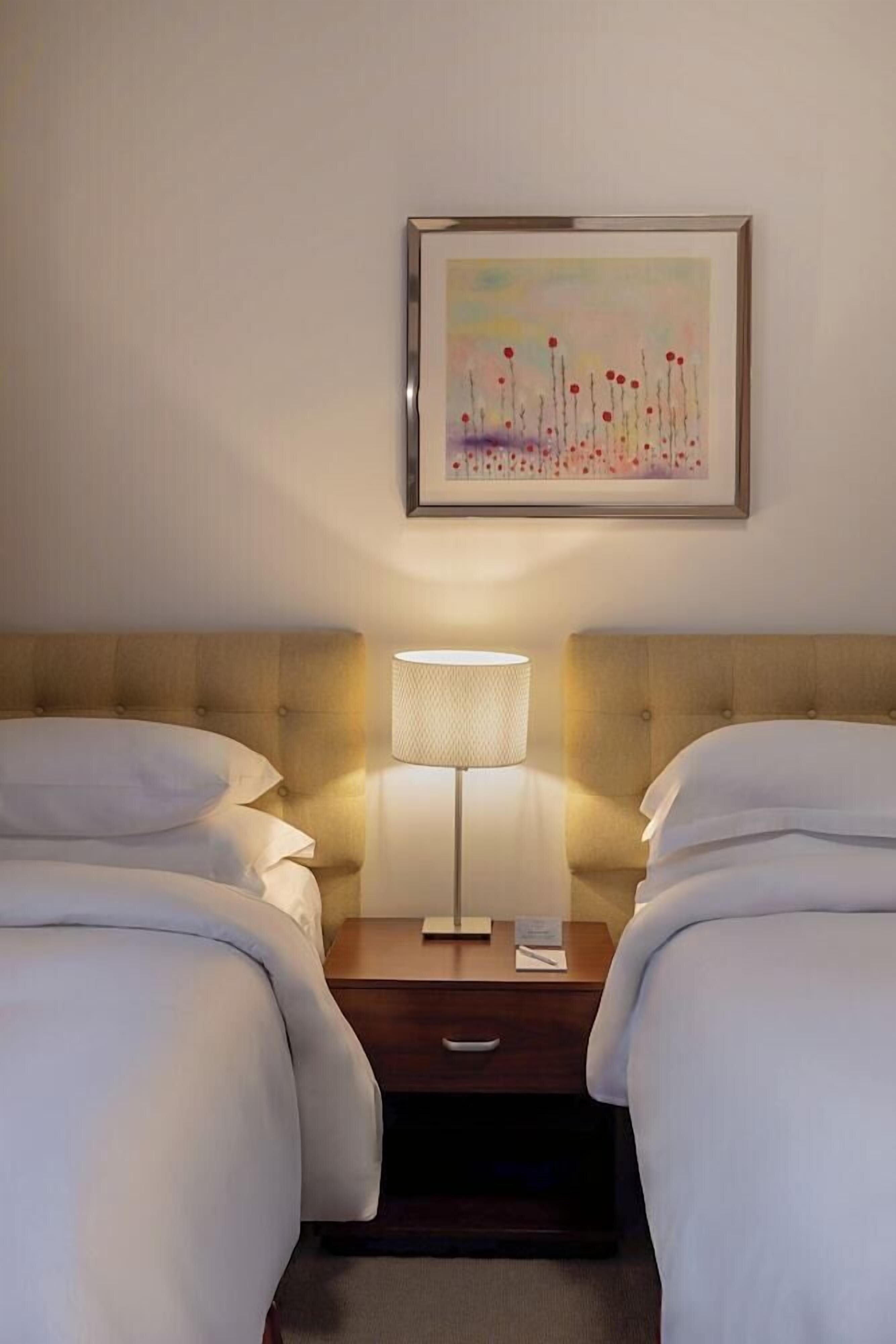 Premium bedding, memory-foam beds, minibar, in-room safe