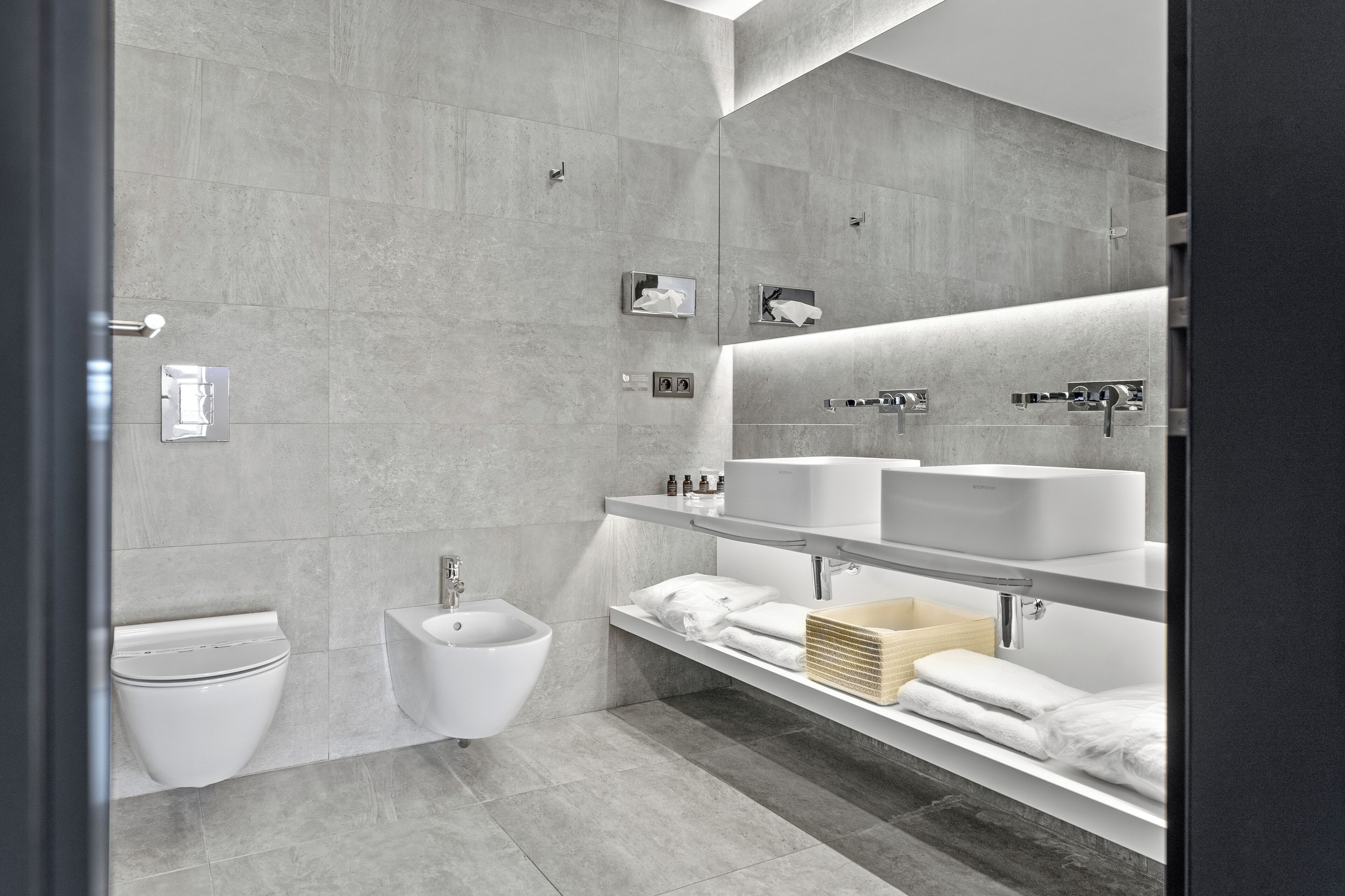 designer toiletries, hair dryer, bathrobes, slippers