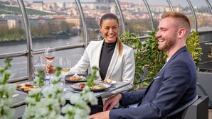 A couple dining at a table with a view of a cityscape. - Dancing House hotel - Tančící dům (Prague)