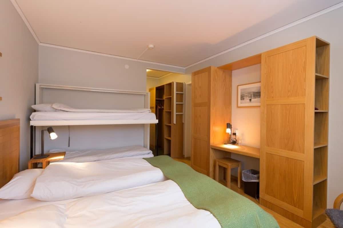 family room | desk, laptop workspace, blackout curtains, bed sheets