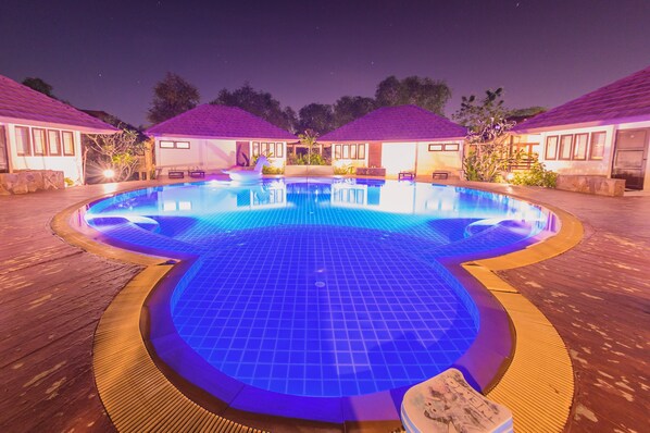 Poolside Canal View Villa | Outdoor pool | Outdoor pool, pool umbrellas, sun loungers