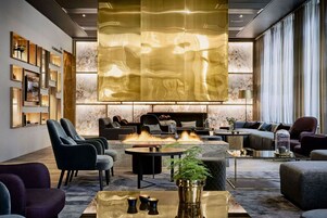 3 bars/lounges, rooftop bar, lobby lounge