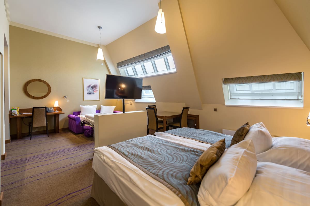 Suite Junior | Biancheria da letto di alta qualità, minibar, una cassaforte in camera