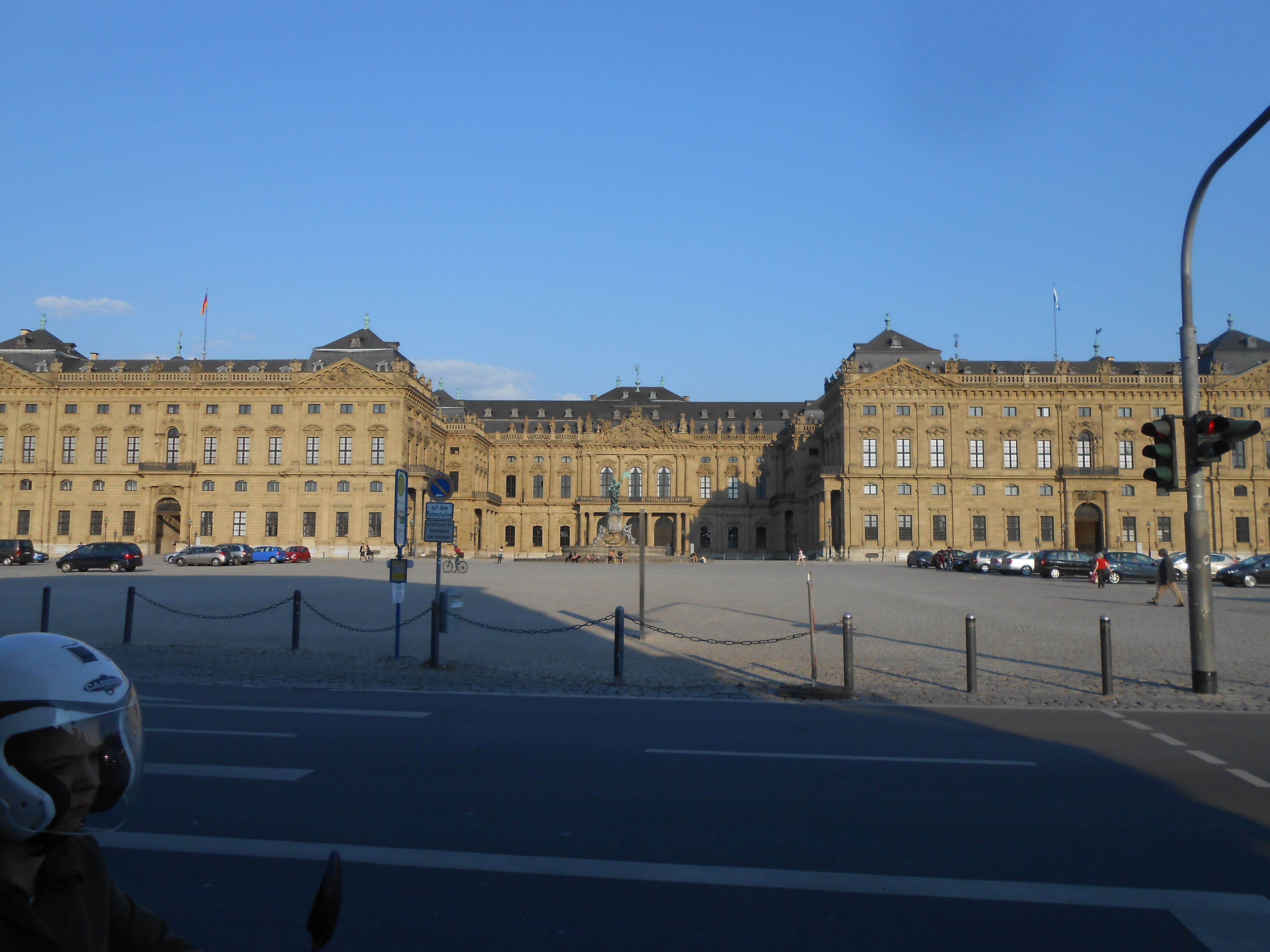 A large, ornate building with classical architecture, featuring symmetrical windows and decorative elements.