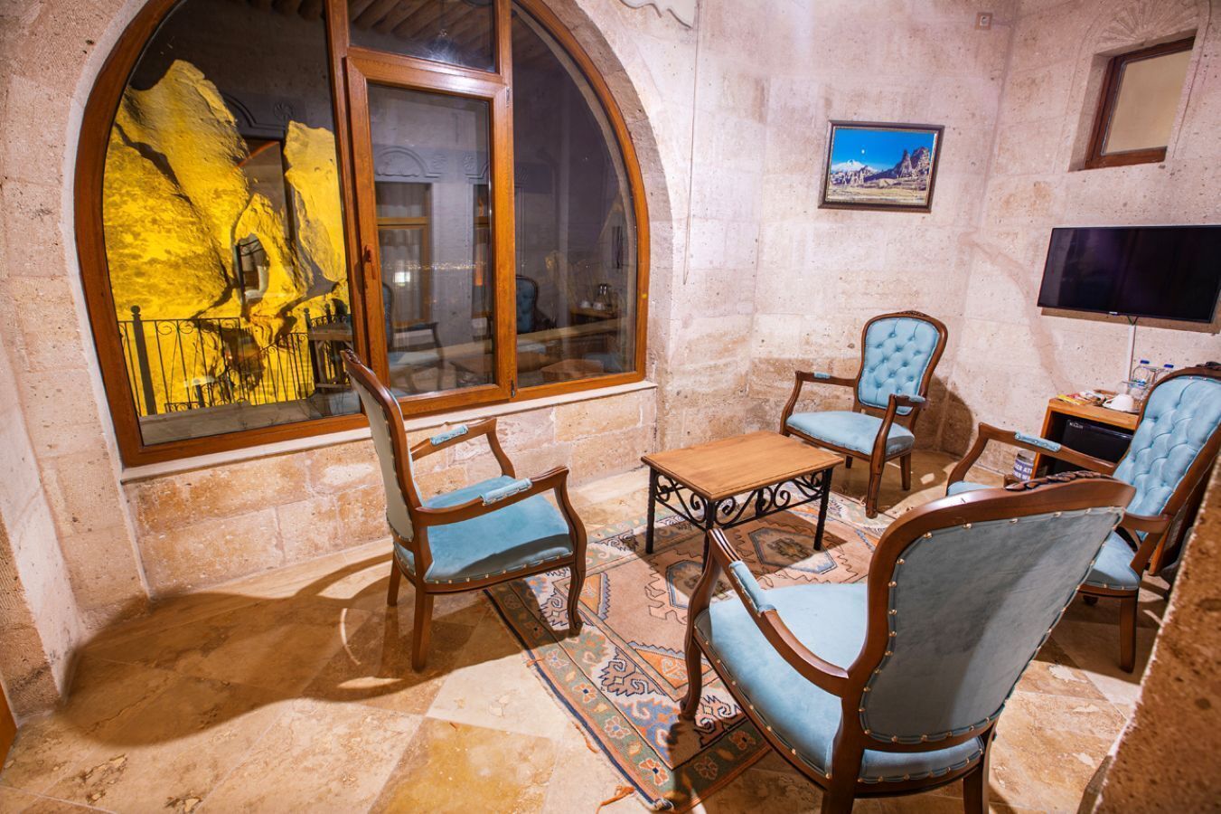 panoramic suite | living area | 82-inch lcd tv with satellite channels, tv, heated floors