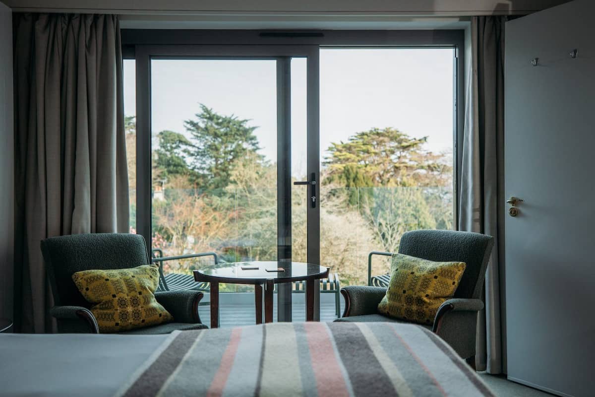 deluxe double or twin room | hypo-allergenic bedding, in-room safe, desk, iron/ironing board