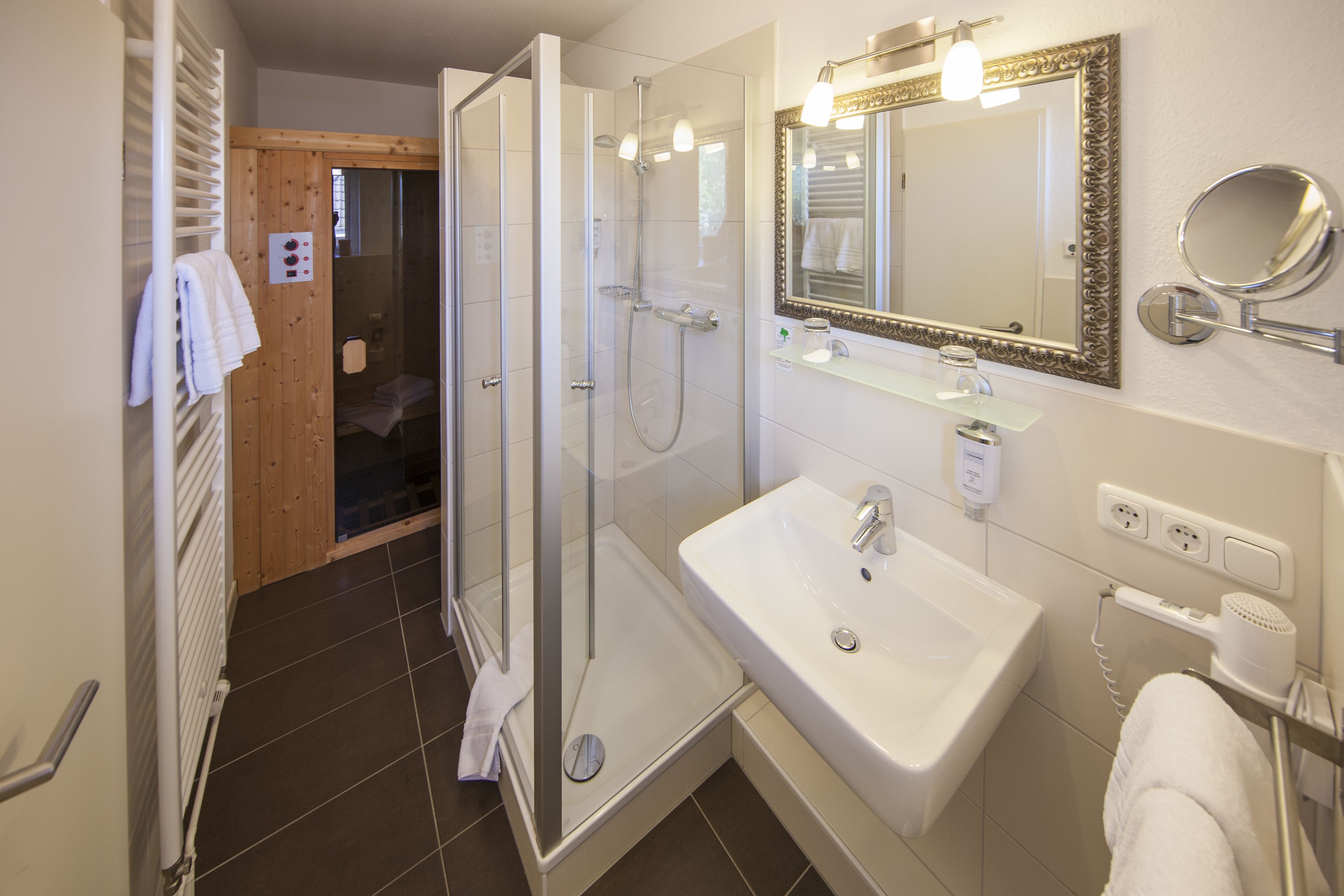 small wellness suite | bathroom | shower, free toiletries, hair dryer, towels