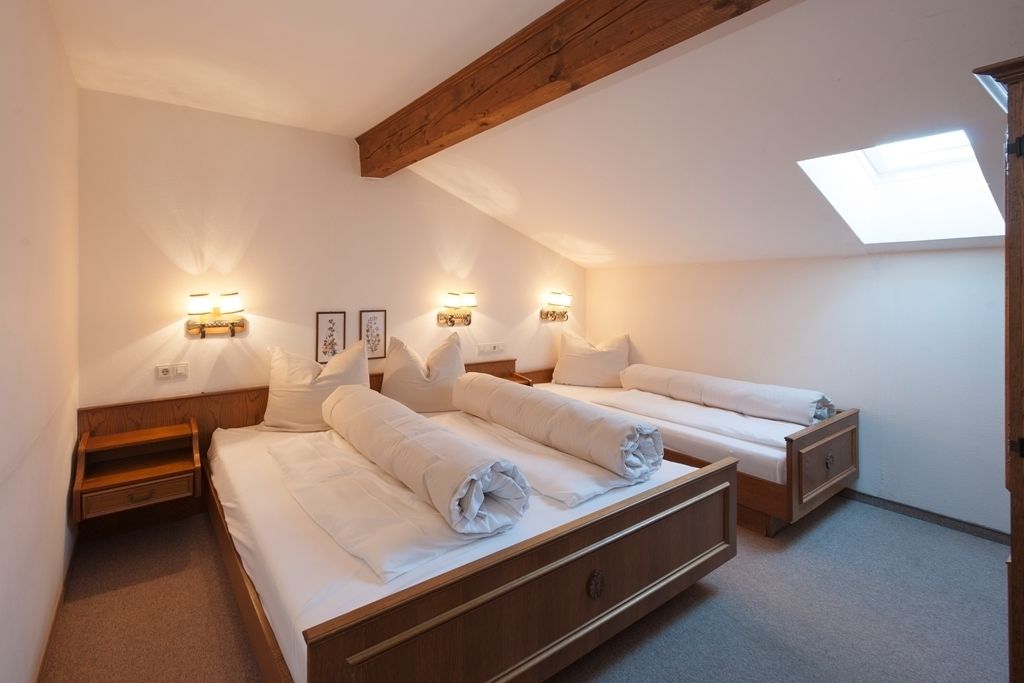 family room, 2 bedrooms, garden view, garden area | in-room safe, bed sheets